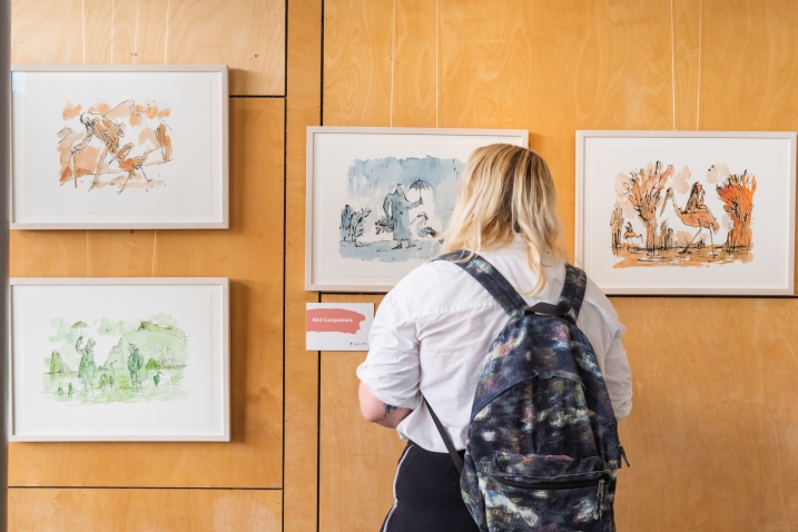 Visitor looking at Quentin Blake prints in WWT Slimbridge's gallery. Credit Amy Alsop.jpg